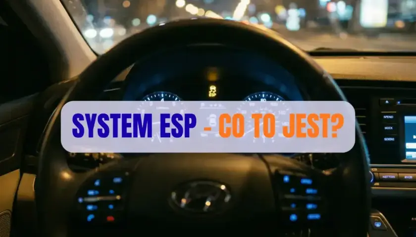 Widok z wnętrza samochodu nocą. Na desce rozdzielczej świeci się kontrolka ESP, a na ekranie tekst "SYSTEM ESP - CO TO JEST?".